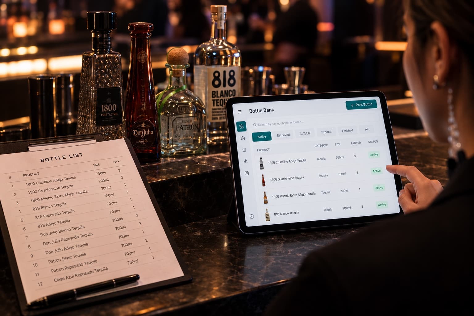 A printed bottle list on a clipboard beside an iPad showing the bottles already loaded into Bottle Bank